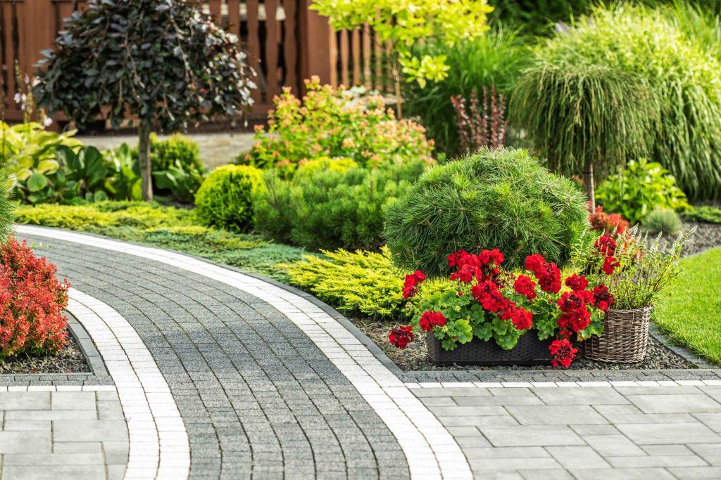 landscaped garden with brick walkway and floral ac 2026 03 24 09 05 06 utc
